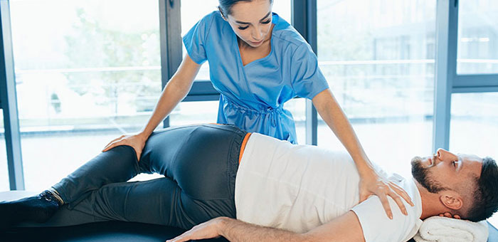 Patient receiving sciatica treatment from Buckeye chiropractor