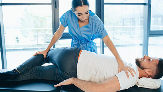 Patient receiving sciatica treatment from Buckeye chiropractor